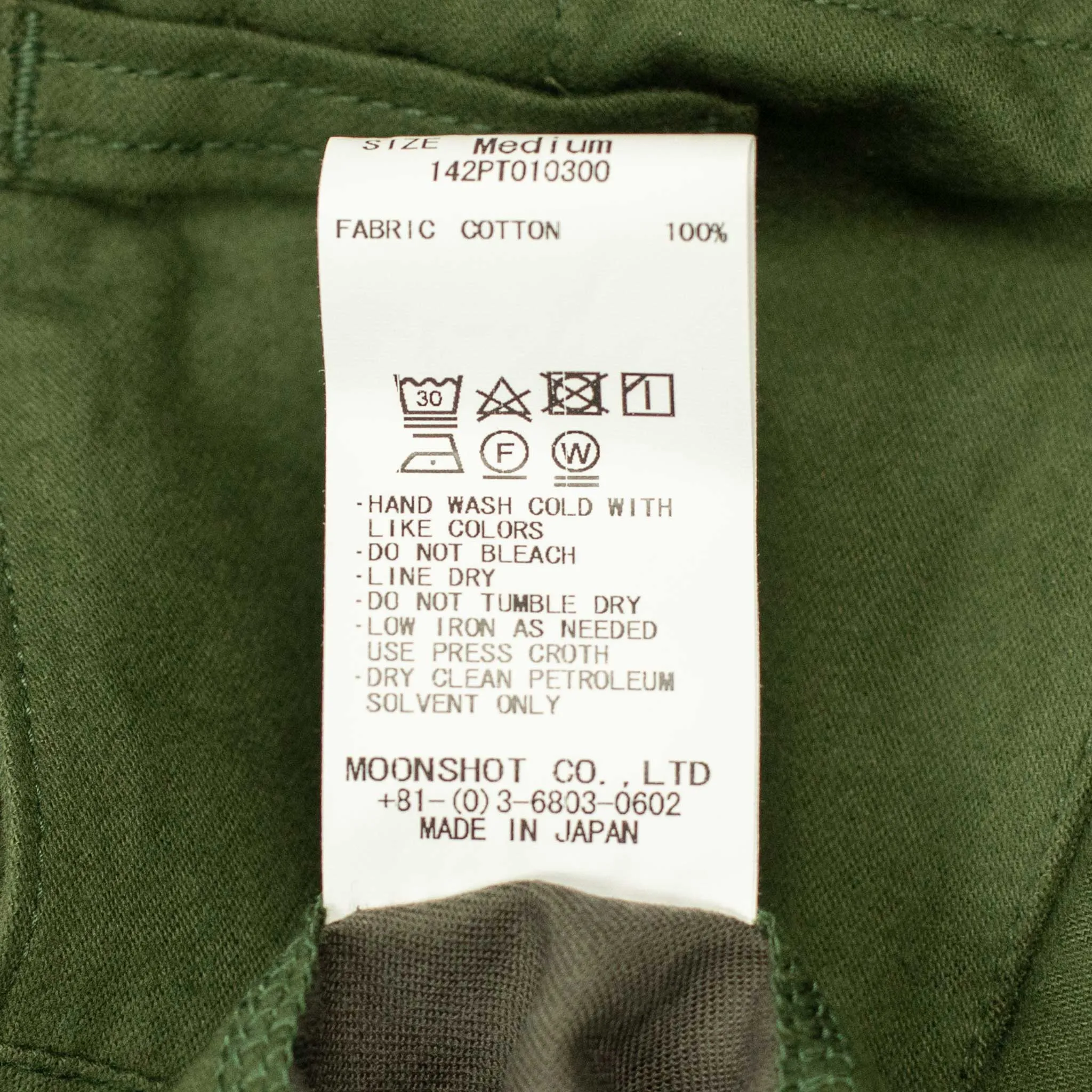 Pleated trousers in green lightweight moleskin