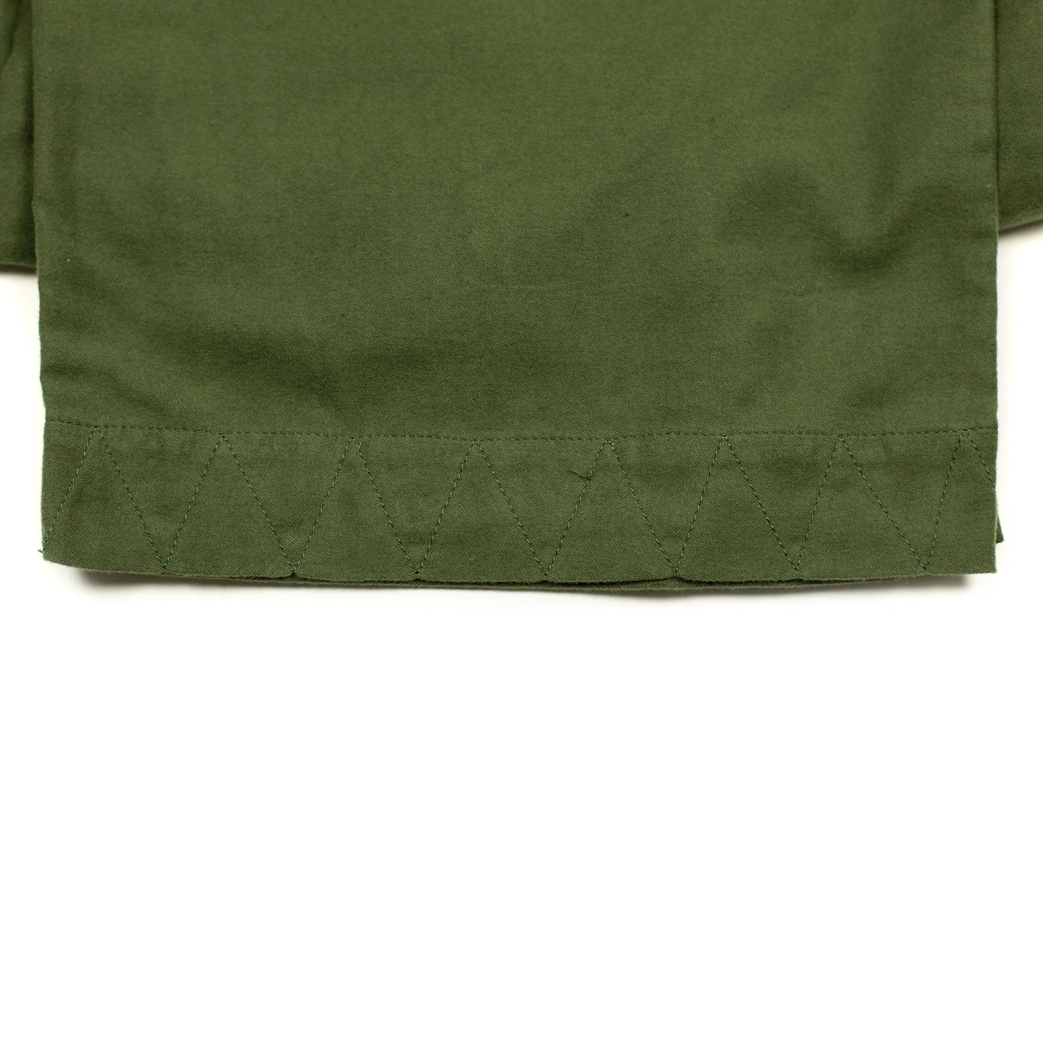 Pleated trousers in green lightweight moleskin